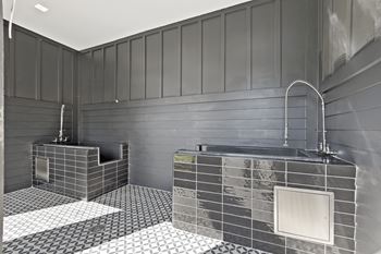 a bathroom with a shower and a sink and a tub